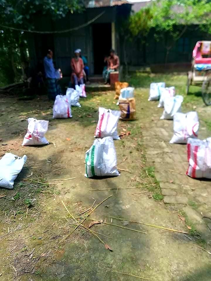 Food packages arranged along an outdoor distribution area