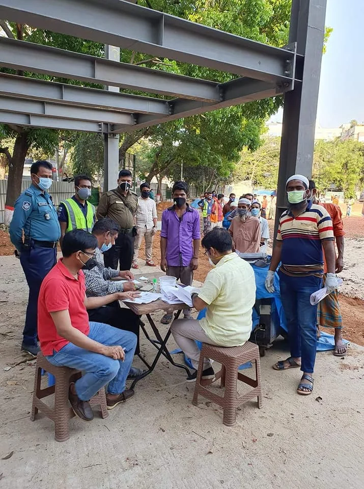Volunteers and community members gathered outdoors